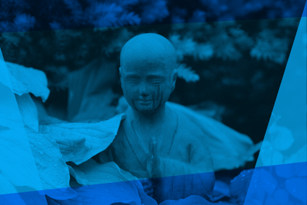 Buddha nestled inside green leaves